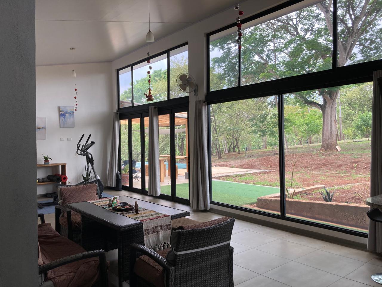 Kitchen and living room in the Beautiful Nature-Surrounded House for Sale in Guanacaste Costa Rica