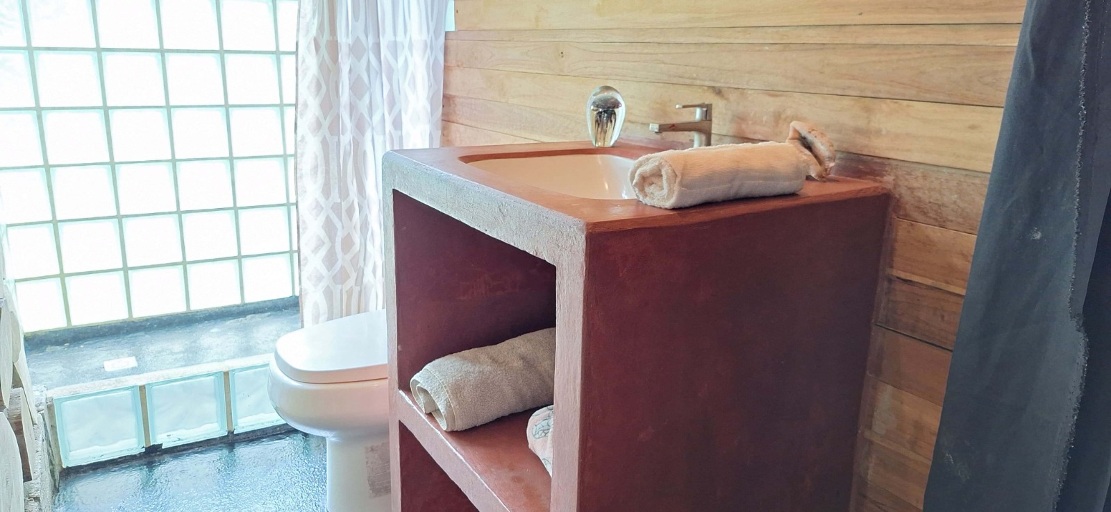 Modern bathrooms on the first floor of the main house